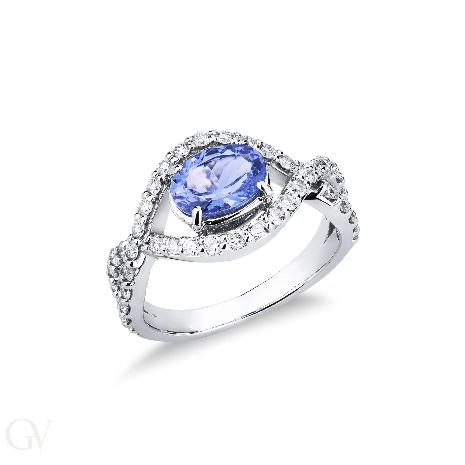 Anello in oro bianco 18k con tanzanite ovale, circa 6x7 mm, e diamanti