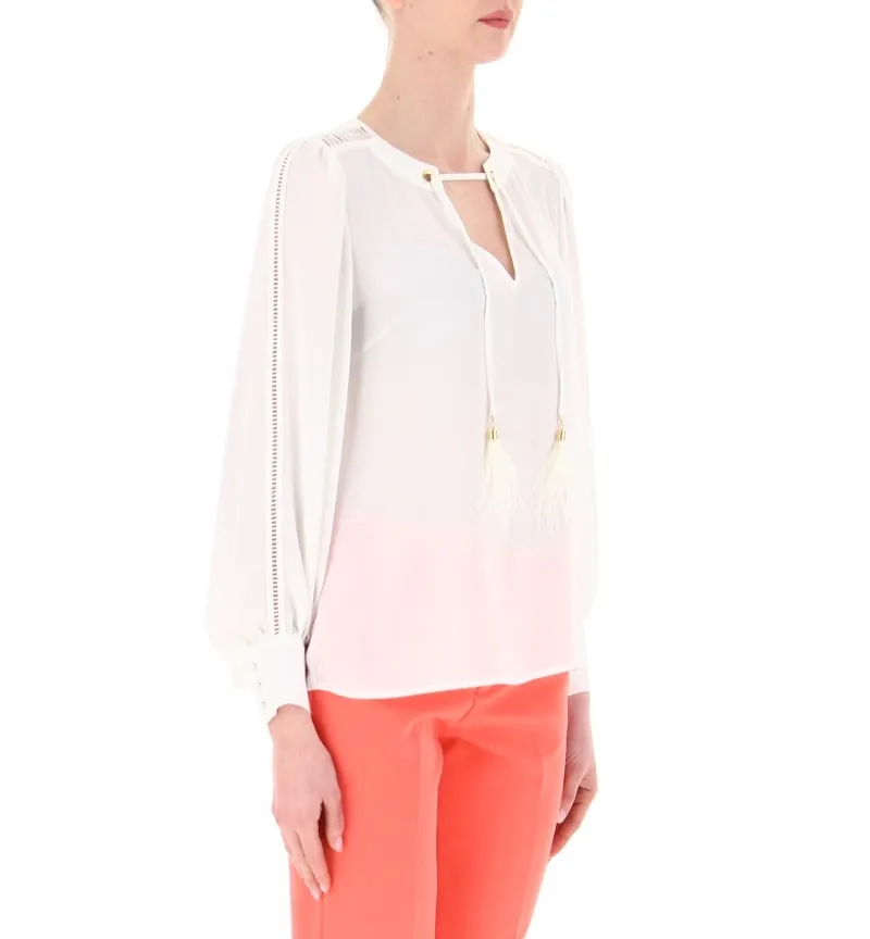 Blusa con piume