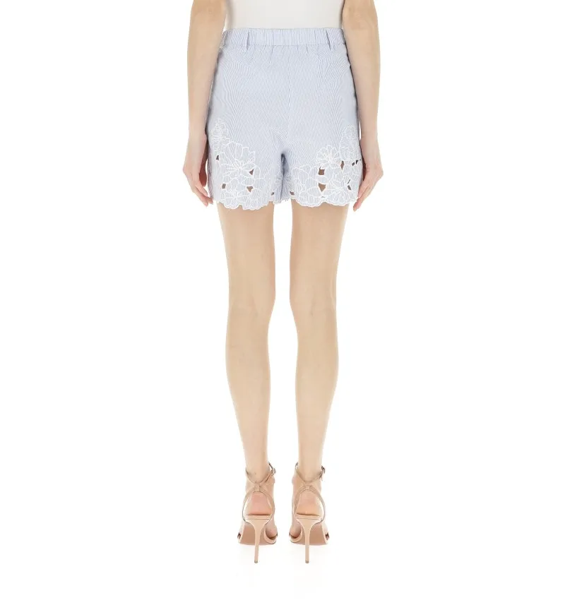 Shorts con ricami